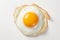 Top view of a mouthwatering fried egg with a perfectly cooked yolk, isolated on a white background