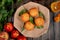 top view of muffins with green leaves on craft brown paper with fresh ripe nectarines on rustic wooden background