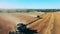 Top view of multiple combines reaping rye in the field