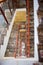 The top view on multystoried ladder flight. A modern marble ladder in office building