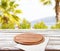 Top view napkin and pizza desk on wooden table with blurred beach background, mock up
