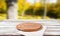 Top view napkin and pizza desk on wooden table with blurred park background, mock up
