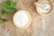 Top view of natural greek yogurt in cup  old wooden table background. Yogurt is delicious tasty and healthy