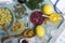 Top view of natural medicines.Dried berries, herbs, fresh lemons, stethoscope, liquid medicines on the blue table.Concept of alter