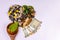 Top view of natural medicines, money, wooden spoon and different spices with green leaves on white background. Heart and cardio