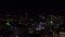 Top view of night city with flashes of fireworks. Stock footage. Dark city with flashes of multicolored fireworks in