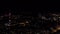 Top view of night city with flashes of fireworks. Stock footage. Dark city with flashes of multicolored fireworks in