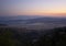 Top view of the night city with Volos lighting in Greece at sunset