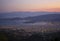 Top view of the night city with Volos lighting in Greece at sunset