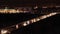 Top view of the night highway at night. Aerial view of the city highway with bridge. Cars ride on the bridge with the