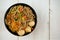 Top view noodle with minced pork , meatballs, dried shrimps and vegetables in black bowl