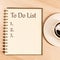 Top view notebook write message To Do List and number list with coffee cup on table