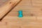 Top view of the number one made from blue plasticine on a wooden table