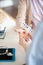 Top view of nurse giving two pills to pensioner