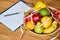 Top view of Nutritionist, dietitian workplace with measuring tape and bowl with healthy vegetables and fruits