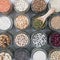 top view of nuts, peas, beans, rice, spelt, oatmeal on white background