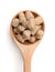 Top view of oats bran pellets in wooden spoon