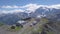 Top view of Observatory in mountains on background of snow peaks. Clip. Spectacular view from Observatory of mountain