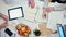 Top View - Office Desk with Devices and Papers at Business Meeting of Work Team