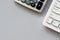 Top view office table, Keyboard and calculator on white background with copy space.