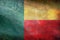 Top view of official retro flag Benin with grunge texture. travel and patriot concept. no flagpole. Plane design, layout. Flag