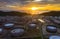 Top view of oil refinery plant chemical factory and power plant with many storage tanks and pipelines at sunset