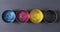 Top view of old CMYK paint cans on dark background. Colorful background.