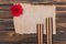 top view of old empty paper, carnation and st. george ribbons on wooden surface