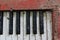 Top view of old piano keyboard with termite-eaten image for vintage instrument concept background.