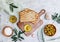 Top view olive oil, olives, toast bread and leaves on white background,