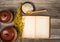 Top view on the opened cookbook and kitchen utensils