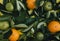 Top view of orange fruit and leaves on table background.