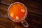 Top view of an orange Mexican iced beer cocktail mix on the table