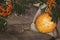 Top view of orange pumpkin on burlap and red rowan on wooden background in rustic style. Happy Thanksgiving and Harvest