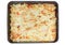 Top view oven tray with cauliflower, cheese and seafood gratin