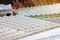 Top view over the glass roof of a greenhouse creating a surreal manmade landscape.