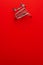Top view of overturned shopping trolley on red background. minimalist photo of pushcart with some copy space