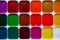 Top view palette of watercolor paints in box isolated on white b