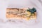 Top view on palo santo sticks with bouquets of dried flowers on white marble table background
