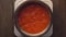 Top view of a pan in which hot chili sauce is stewed