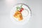 Top view of Pancakes with sour cream and cherry tomatoes on a white background. Carnival menu