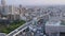 Top view panorama on busy traffic on passway, driving cars and trucks pass by, Osaka, Japan
