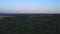 Top view of panorama of forest and horizon with dawn sky. Clip. Beautiful panorama of early dawn sky over forest. Green