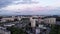 Top view of the panorama of residential quarters of the city with high-rise buildings and a beautiful sky with the moon