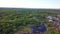 Top view of panorama of village on background of green forest. Clip. Cottage town is great place for quiet life near