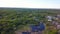 Top view of panorama of village on background of green forest. Clip. Cottage town is great place for quiet life near