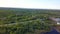 Top view of panorama of village on background of green forest. Clip. Cottage town is great place for quiet life near