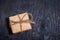 Top view of paper box on black wooden background, close up, con