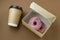 top view paper cup and cardboard box with donuts