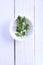 Top view parsley in bowl on white background